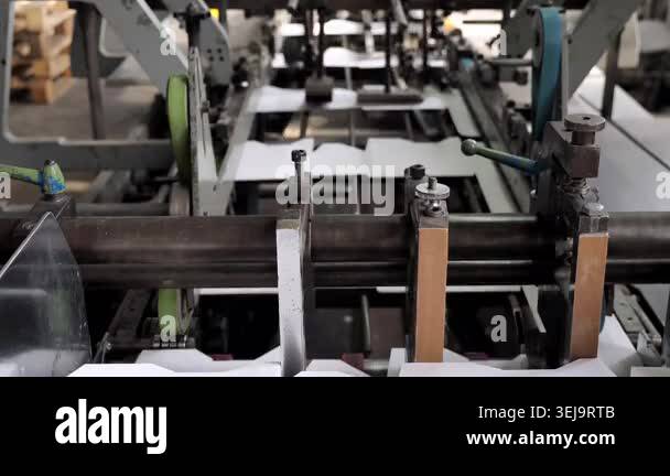 Industrial printing press and die cutting machine processing white ...