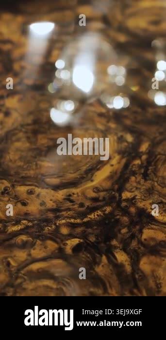 Vertical video. Close-up of marble table surface with natural stone ...
