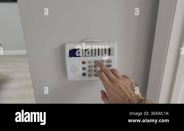 Close up video clip of a person shielding the keypad while typing a ...