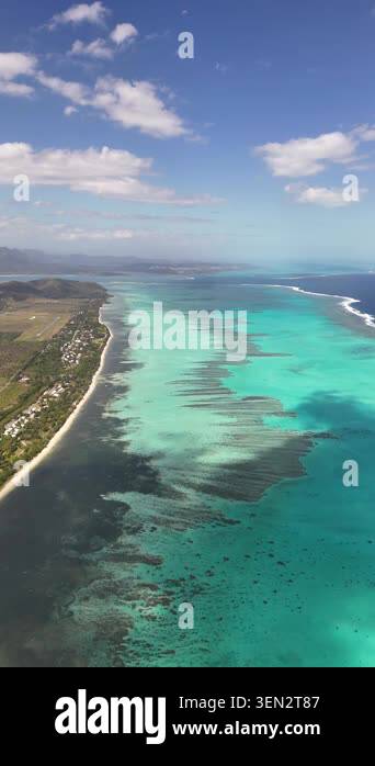Aerial turquoise lagoon coastline in New Caledonia showcasing coral ...