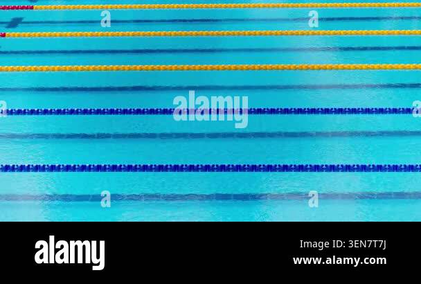 Empty olympic swimming pool lanes with blue and yellow float dividers ...