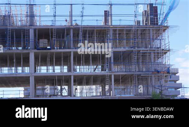 Concrete residential building structure under construction with ...