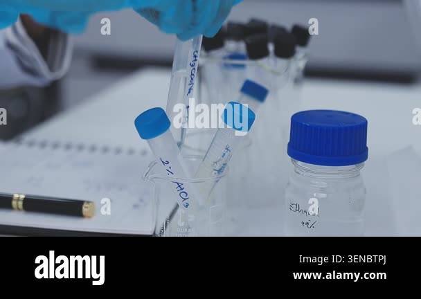 laboratory test tubes and glass of liquid on a white background Stock ...