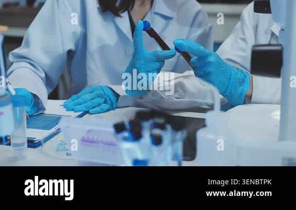 scientist holding a test tube in laboratory Stock Video Footage - Alamy