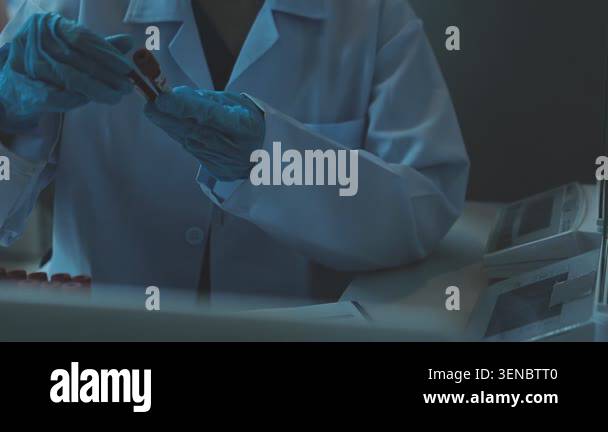 close - up of scientist working with test tube at laboratory Stock ...