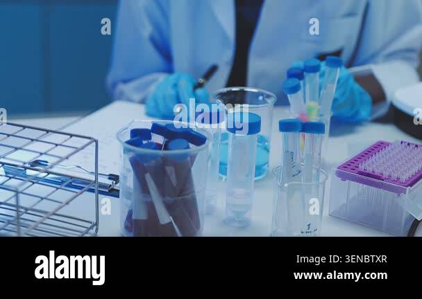 scientist holding a test tube with a liquid in a laboratory Stock Video ...