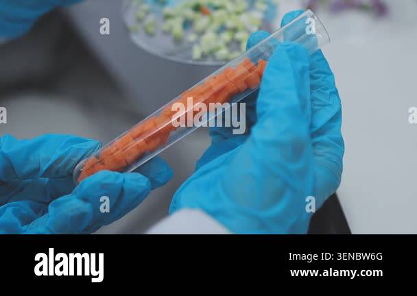 laboratory worker holding a test tube with a sample Stock Video Footage ...
