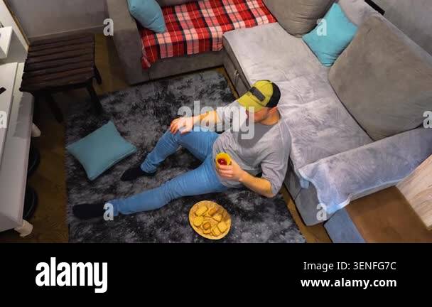 Top view of a man drinking red tea. Slow motion. Drink tea at home on ...