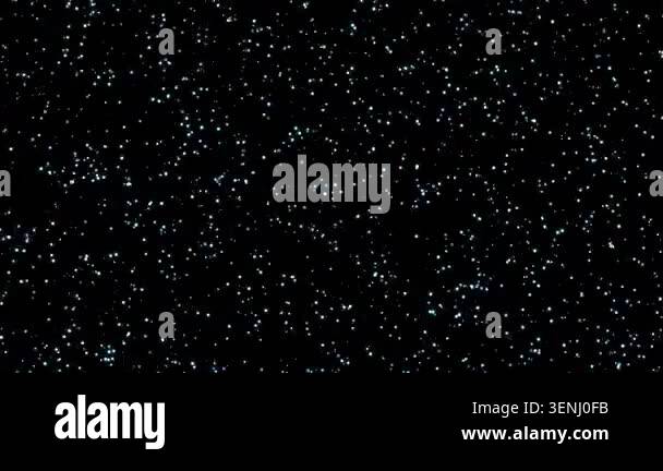 Futuristic coming soon text reveal from shimmering particles on a dark ...