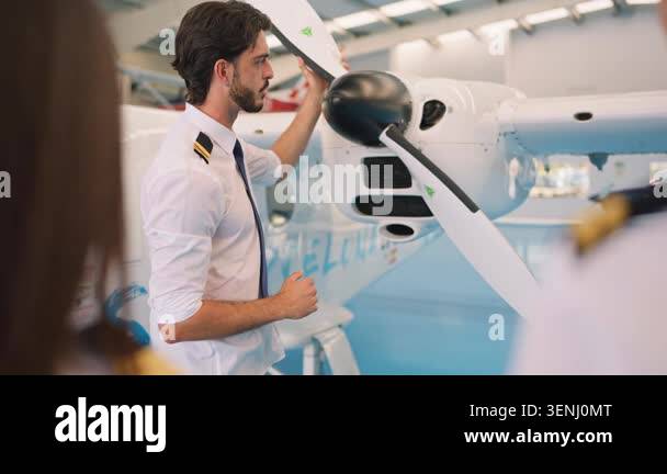 Professional flight instructor teaching a class of student pilots about ...