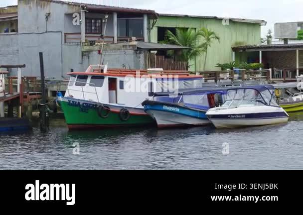 Footage show boats docked at a vibrant waterfront in Ilha do Mel ...