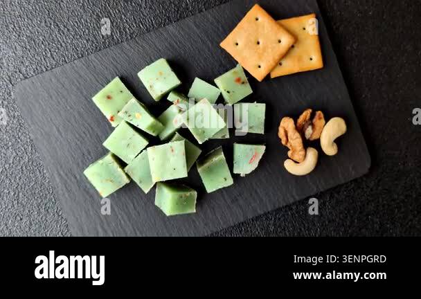 Hard green pesto cheese with herbs as a pasta ingredient. Green pesto ...