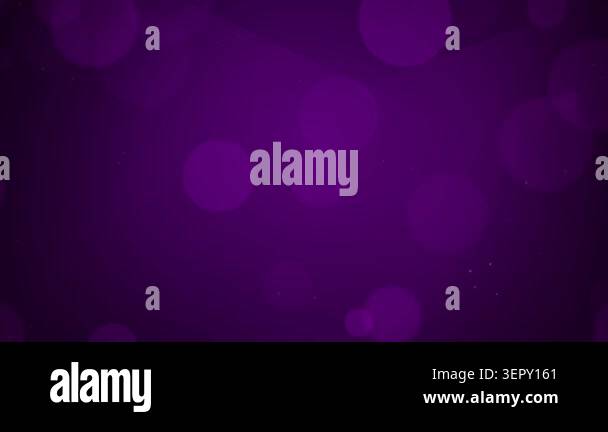 A dark purple abstract background featuring soft glowing bokeh light ...