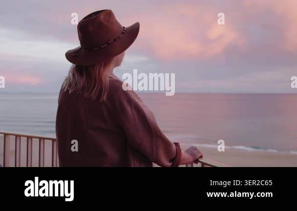 Curated visual reference: Picture Idea: Woman In Wide Brim Hat Enjoying Peaceful Ocean View From