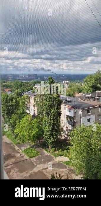 Photo inspiration: Visual Reference: Black Smoke Rises From Factory Chimneys Over A Green Residential