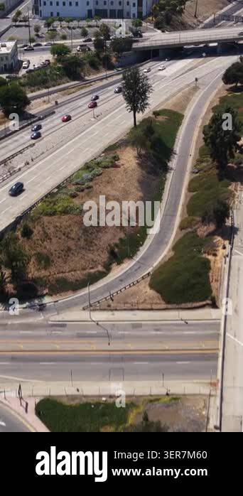 los-angeles-highway-interchange-traffic-with-city-skyline-revealing-in