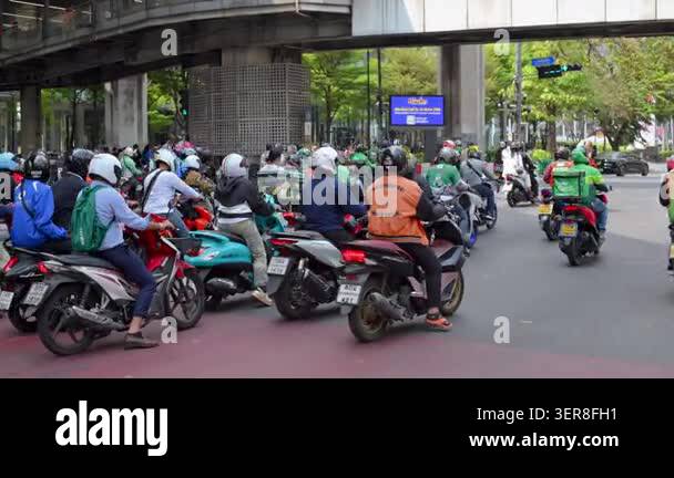 BANGKOK, THAILAND - MARCH 3, 2023: Heavy traffic at a city intersection ...