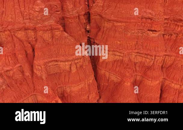 Deep vertical fissure inside eroded clay cliffs, Teruel, Spain. Close ...