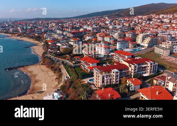 Curated visual reference: Picture Idea: Drone View Of Coastal Buildings With Red Rooftops Along Sandy