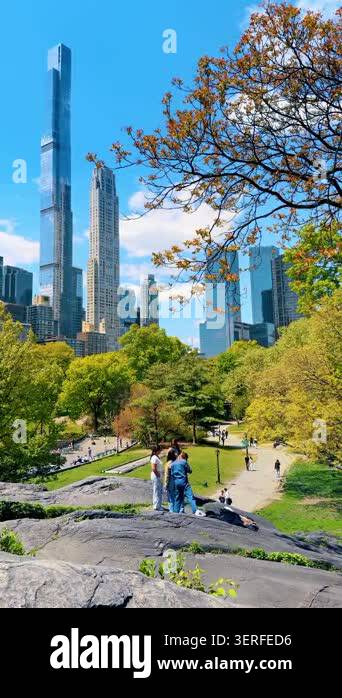 New York, USA, 22 May 2026: Group of people on Central Park rocks ...