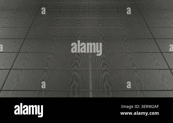 Camera moving above black charred wooden tiles with seamless surface ...
