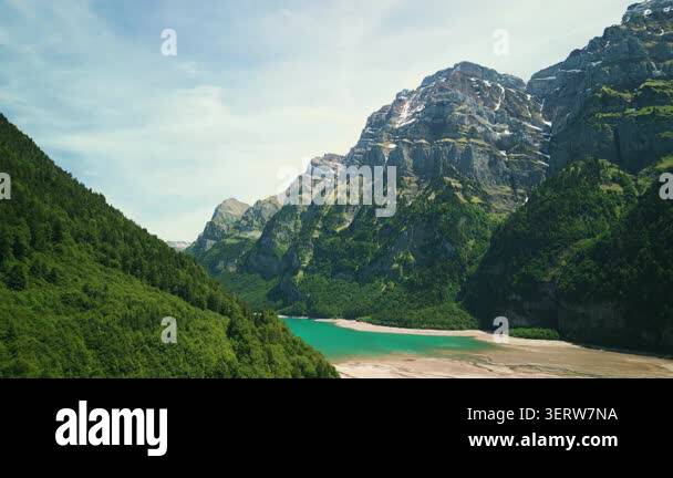 canyon-between-mountains-with-beautiful-lake-with-calm-turquoise-water
