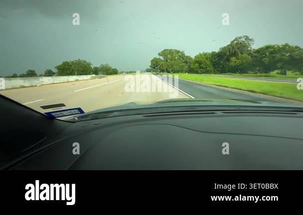 Dashboard view road after rain with scattered droplets on windshield ...