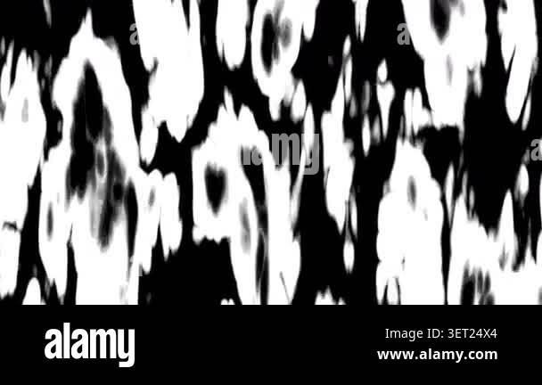 Abstract black ink spots appearing on white background. Organic motion ...