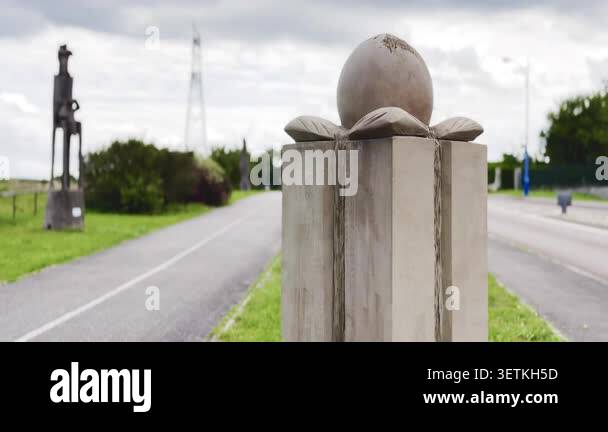 Mirecourt, France August 3 2025 Carved stone egg sculpture on a — free download