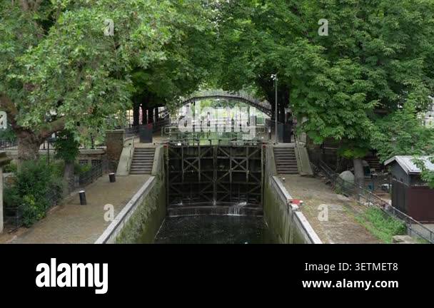 Canal lock gate system controls water level on Saint-Martin canal in ...