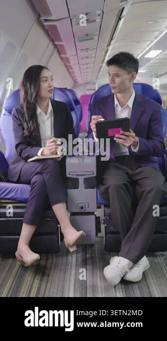 Professional Asian businessman and businesswoman having a discussion ...