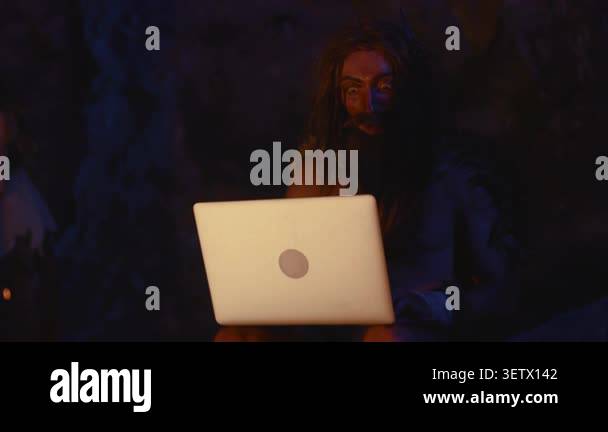 A very humorous portrayal of a caveman hilariously using modern ...