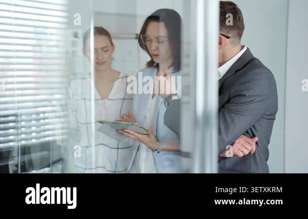 Diverse business professionals actively engaging in a strategic ...