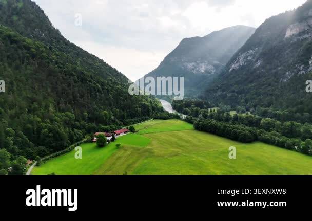 Wide view of green meadows, forests and rocky peaks of the Bavarian ...
