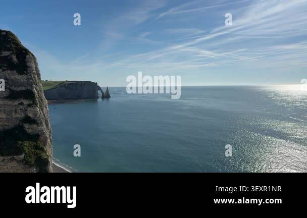 Scenic view of Etretat white chalk cliffs and blue ocean in Normandy ...