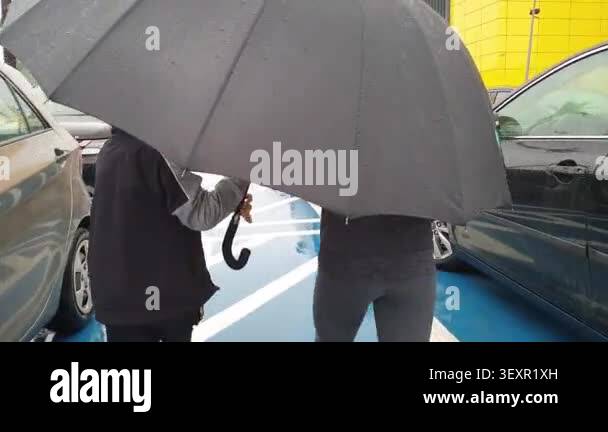 Keep sharing an umbrella Stock Video Footage - Alamy