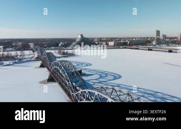 Aerial view shows Riga railway bridge over the frozen Daugava River ...