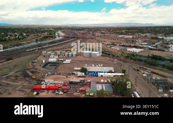 Drone circles above Pueblo Colorado industrial rail yard showing ...