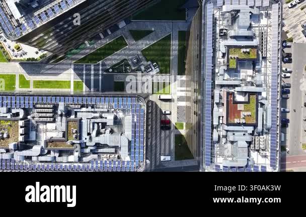 Aerial view of modern business center showcasing rooftop gardens, solar ...
