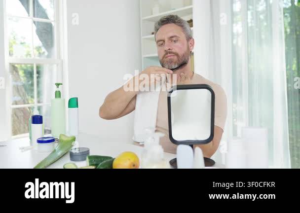 Daily self care routine with combing hair. Man combing hair to shape ...