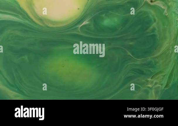 Paint splash. Ink wave. Defocused green yellow color shiny bright ...
