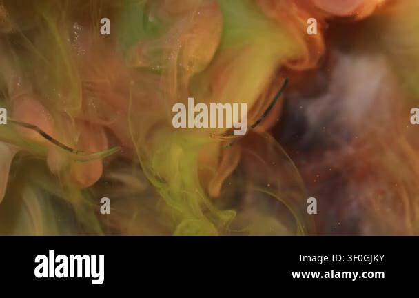 Paint blend. Underwater smoke. Defocused orange green yellow color ...