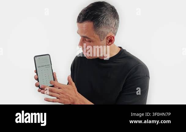 Man pointing to a calculator screen with sum Stock Video Footage - Alamy