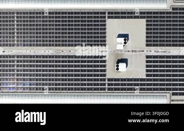 Aerial drone view flying over numerous solar panels installed on the ...