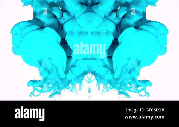 Cyan ink expands in water as a mirrored Rorschach-style shape on white ...