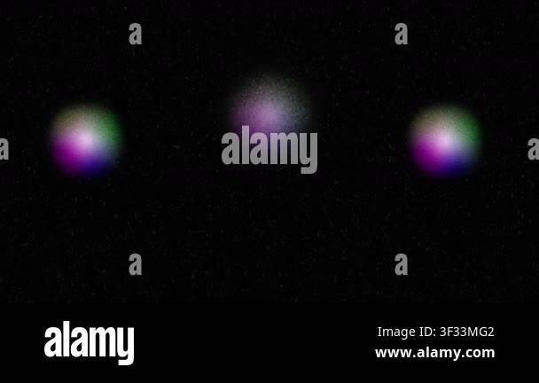 Three softly glowing color spheres with colorful gradient on black ...
