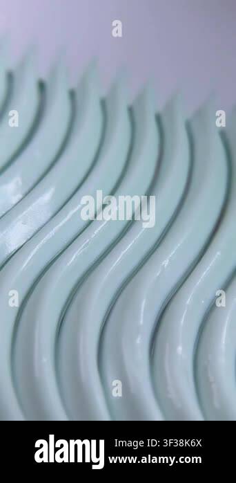 Close up of beauty cream featuring an elegant wave pattern. Self care ...