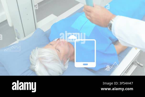 Patient lying on table, tech placing scanner on pad, showing medical ...
