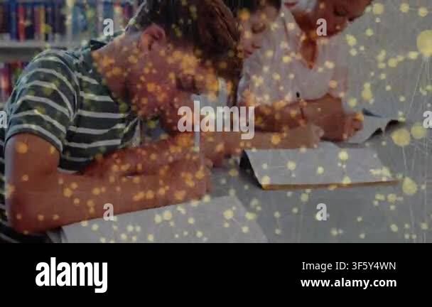 3 students studying as camera pulling left student glancing, yellow ...