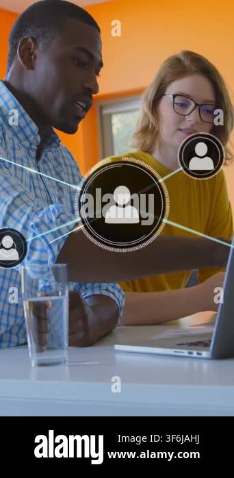 Vertical video: Man pointing at laptop, network icons expanding over ...